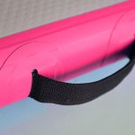 Close-up view of the handle on an AirTumble inflatable mat, designed for easy portability and handling during gymnastics and sports activities.