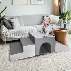 Child playing on Airtumble Play Corner Set with anti-slip base and Velcro connectors.