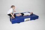 Kids playing on a blue AirTumble gymnastics mat, showing its safety and support.