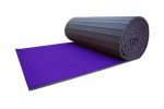 Air Tumble Carpet Roll Out Mat in purple, partially unrolled for gymnastics or cheerleading practice.