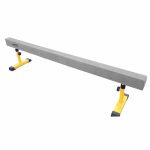 AirTumble balance beam, a long, narrow beam mounted on two stands, designed for gymnastics practice and balance training.