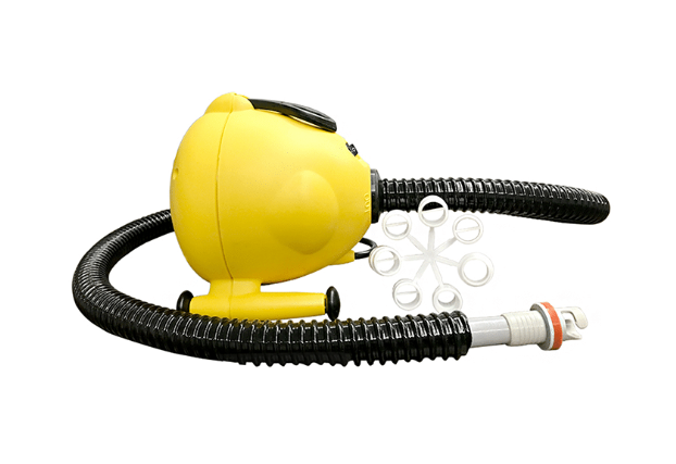 AirTumble electric pump inflating an air track mat at home gym setup