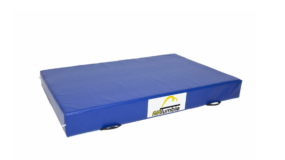 Athlete practicing flips on AirTumble crash mat for safe gymnastics training