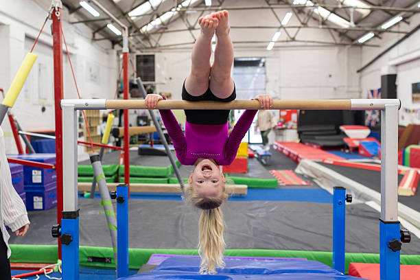 Gymnastics setup featuring Airtumble adjustable bars and a matching air mat for skill training and home workouts.
